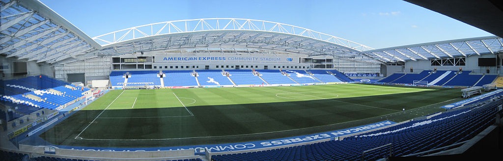 Image: Wikimedia Commons / Julian P Guffogg / Amex Stadium Pitch panorama / CC BY-SA 2.0