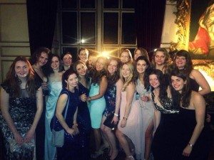 women at annual ball rowing