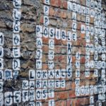 A crossword puzzle painted onto a brick wall / Image: Unsplash