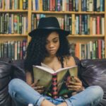 Girl in bookshop reading a book love