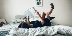 Girl reading on bed - summer reading list