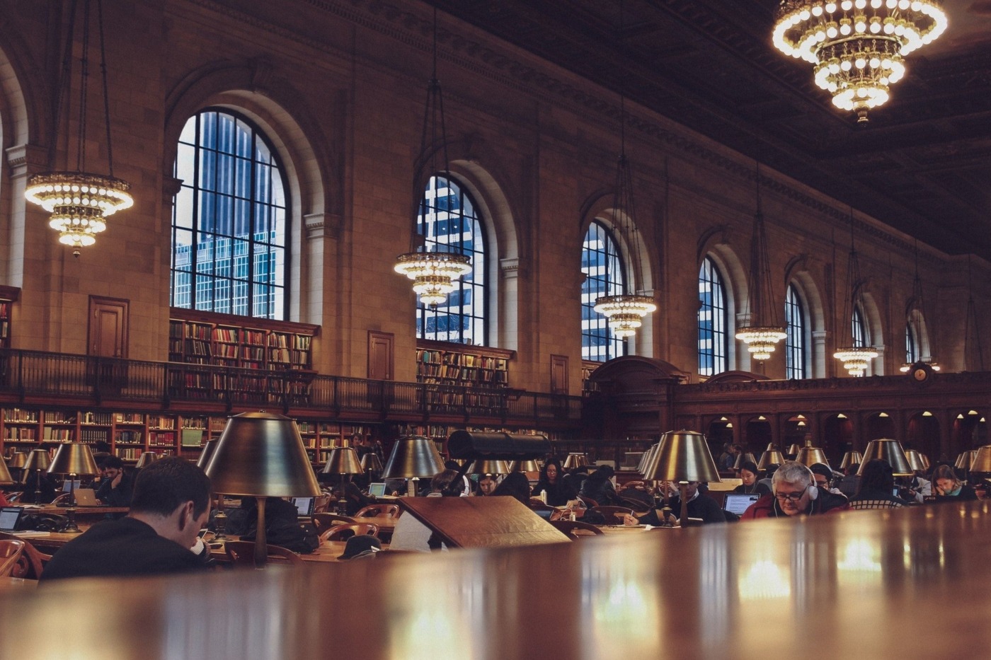 New York public library inside view. People studying.