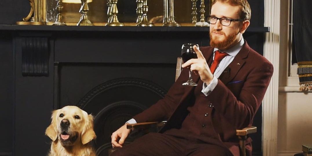 Samuel Dodson sat on a chair with a dog
