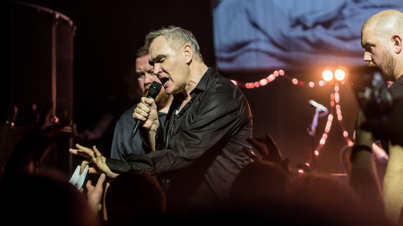 Morrissey on dark lit stage