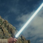 Rey with lightsaber