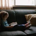 girl reading on sofa - jacqueline