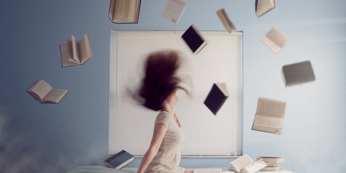 girl with books flying a book