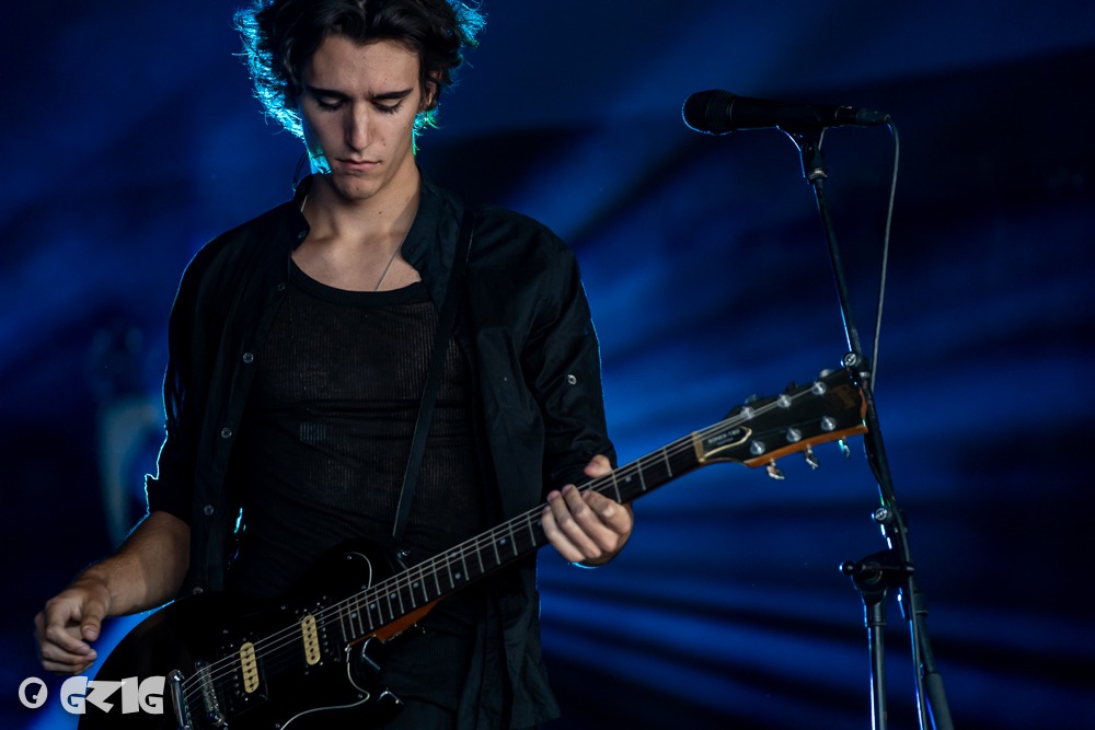 Tamino Amir performing live with a guitar