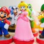 figurines of Mario, princess peach, and luigi