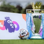 premier league trophy and football