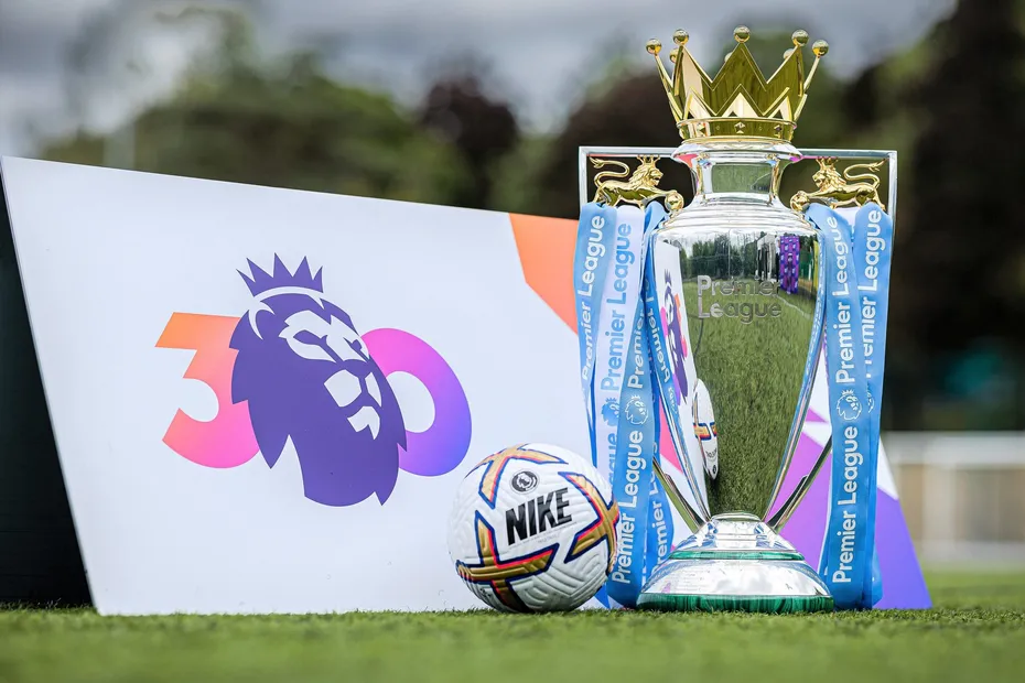 premier league trophy and football