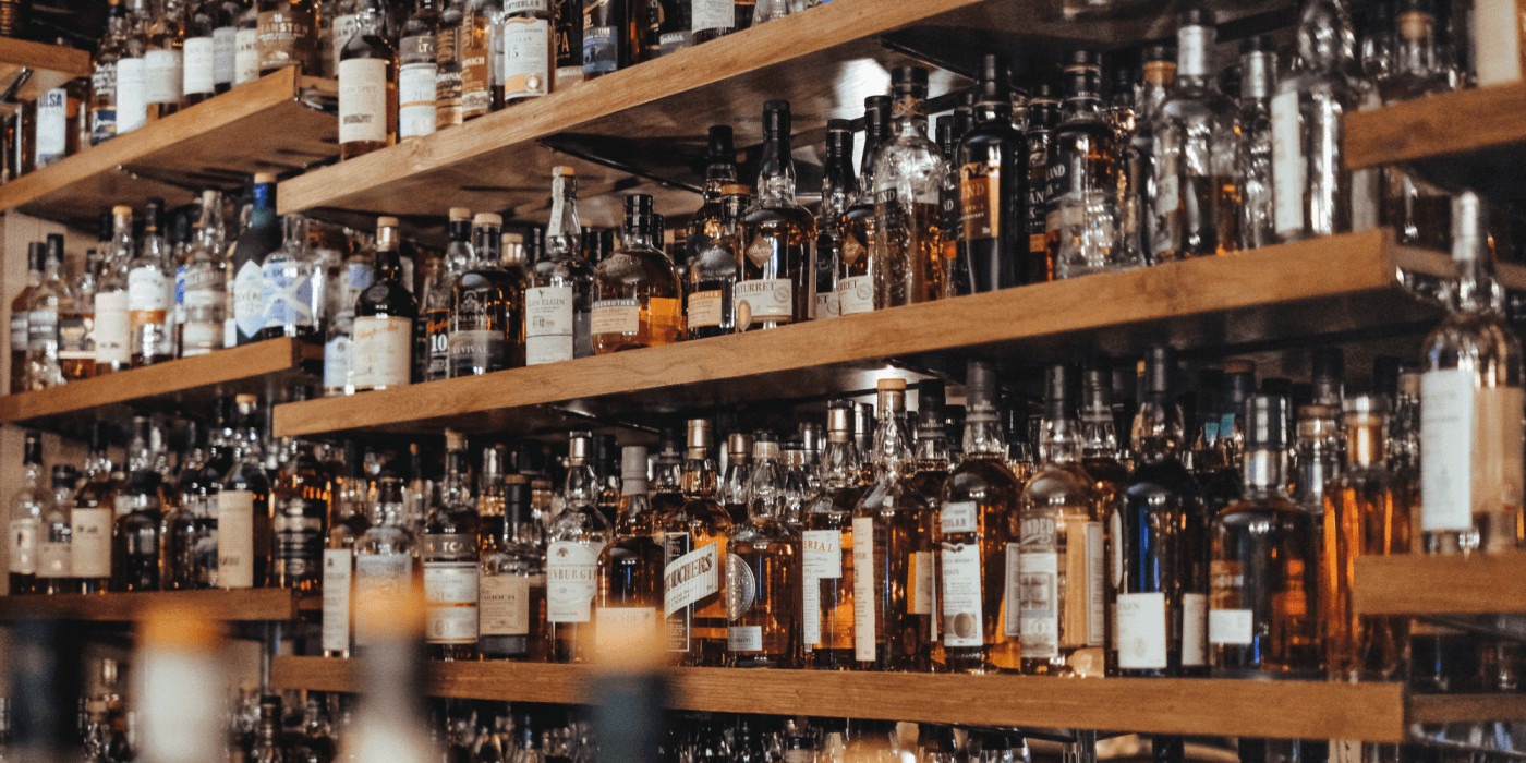 A cabinet filled with bottles/ Image: Unsplash