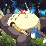 Totoro sleeping on the roots of a tree with all the children and other characters sleeping on and around him.