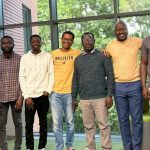 A group of students standing side by side. They are participants in a symposium on Nigeria's economic and social development