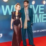 Andrew Garfield holds a cut-out of Florence Pugh at a film premier