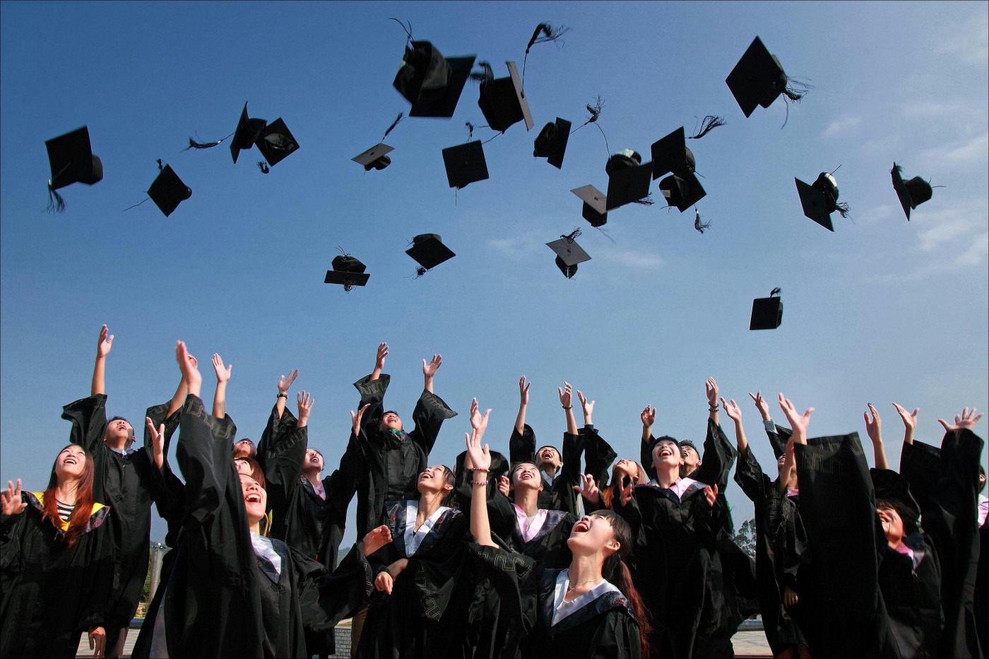 University students celebrating graduation.