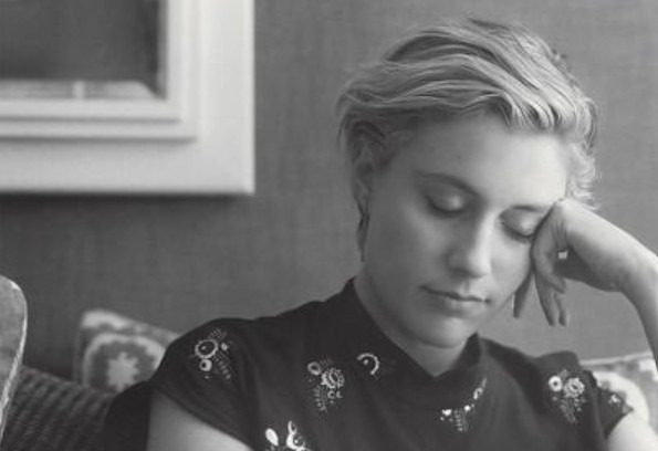 Greta Gerwig resting on her hand