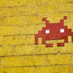Yellow brick wall with red pixel avatar