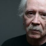 A photograph of film director John Carpenter