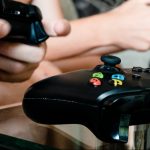 children playing games, holding controllers