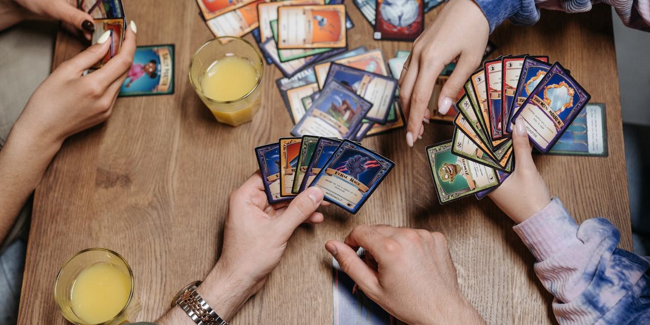 overhead shot of group playing card game