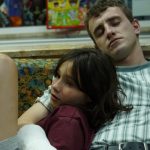 Aftersun: father and daughter asleep on sofa