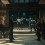 Various superheroes in a room