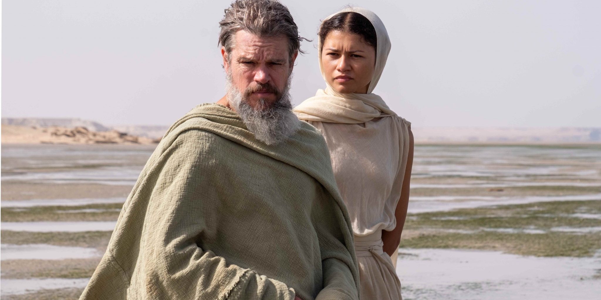 L to R: Matt Damon is Odysseus and Zendaya is Athena in THE ODYSSEY, written, produced, and directed by Christopher Nolan.