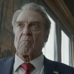(Front) JOHN GOODMAN as President Compson and (behind) ROBERT JOHN BURKE as General Fitzgerald in Warner Bros. Pictures’ “DIGGER,” a Warner Bros. Pictures release.