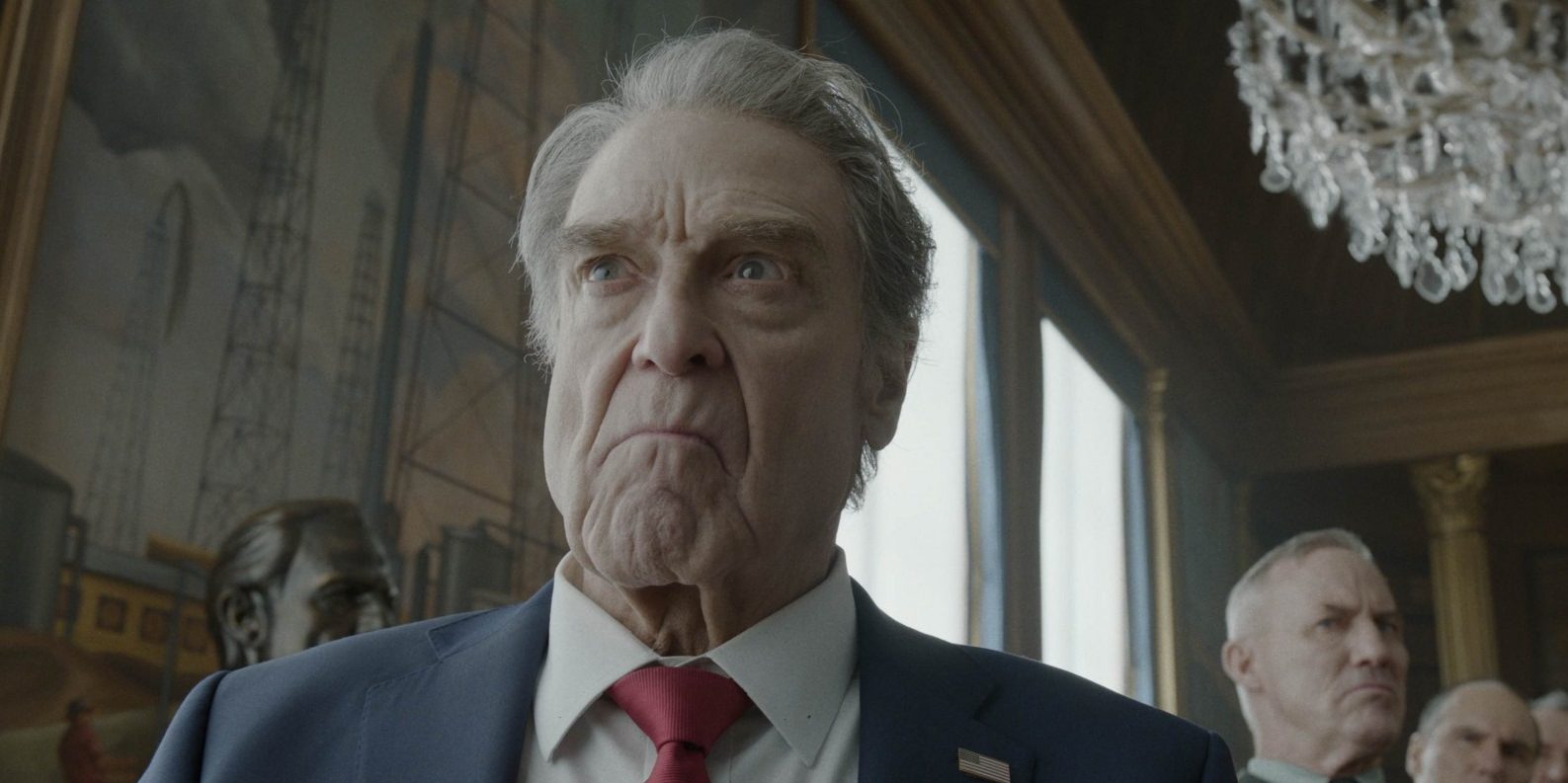 (Front) JOHN GOODMAN as President Compson and (behind) ROBERT JOHN BURKE as General Fitzgerald in Warner Bros. Pictures’ “DIGGER,” a Warner Bros. Pictures release.
